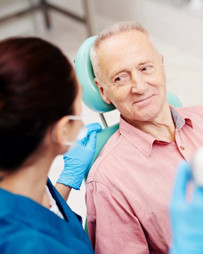 a patient undergoing a dental checkup and cleaning