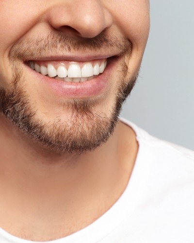 Close up of smiling man with short beard