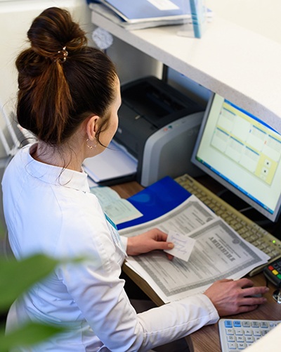 Receptionist working at a desk