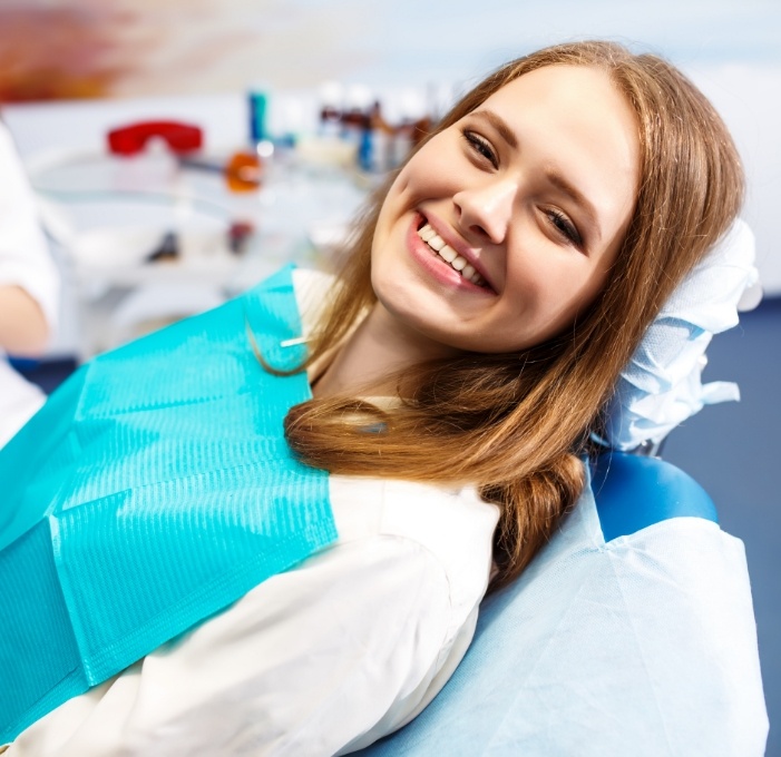 Smiling woman sitting in dental chair