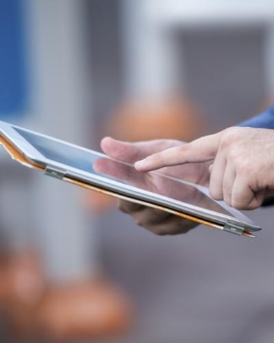 Person scrolling on a tablet