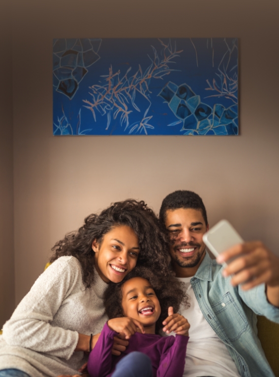 Family of three taking selfie together