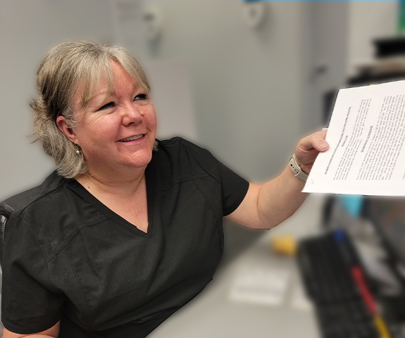 Mississauga dental office manager Christine talking to a patient