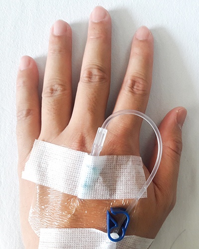 Close-up of patient’s hand with IV