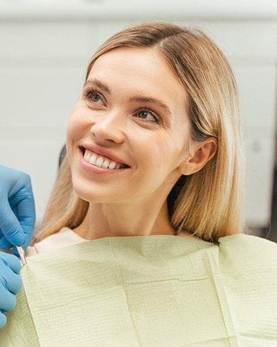 Smiling patient getting ready for dental treatment