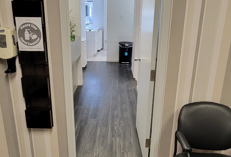 Hallway branching off into dental treatment rooms