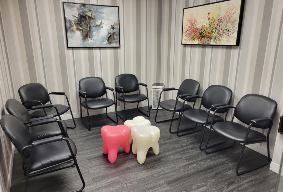 Reception area with three small tooth shaped tables